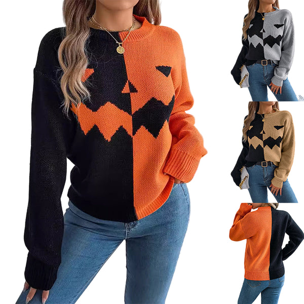 Woman wearing a black and orange sweater with a geometric pattern, standing against a white wall.